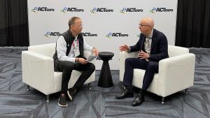 Mike Oakes and Lars speaking on a couch